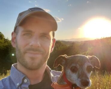 dog and dad run down mountain